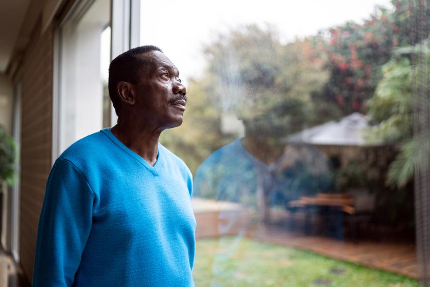 Man looking out the window