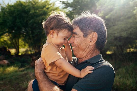 Grandfather holding grandson