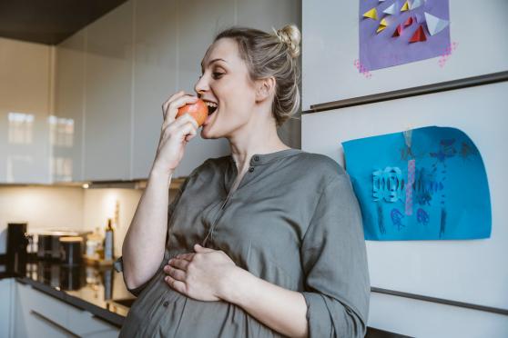 Woman eating an apple